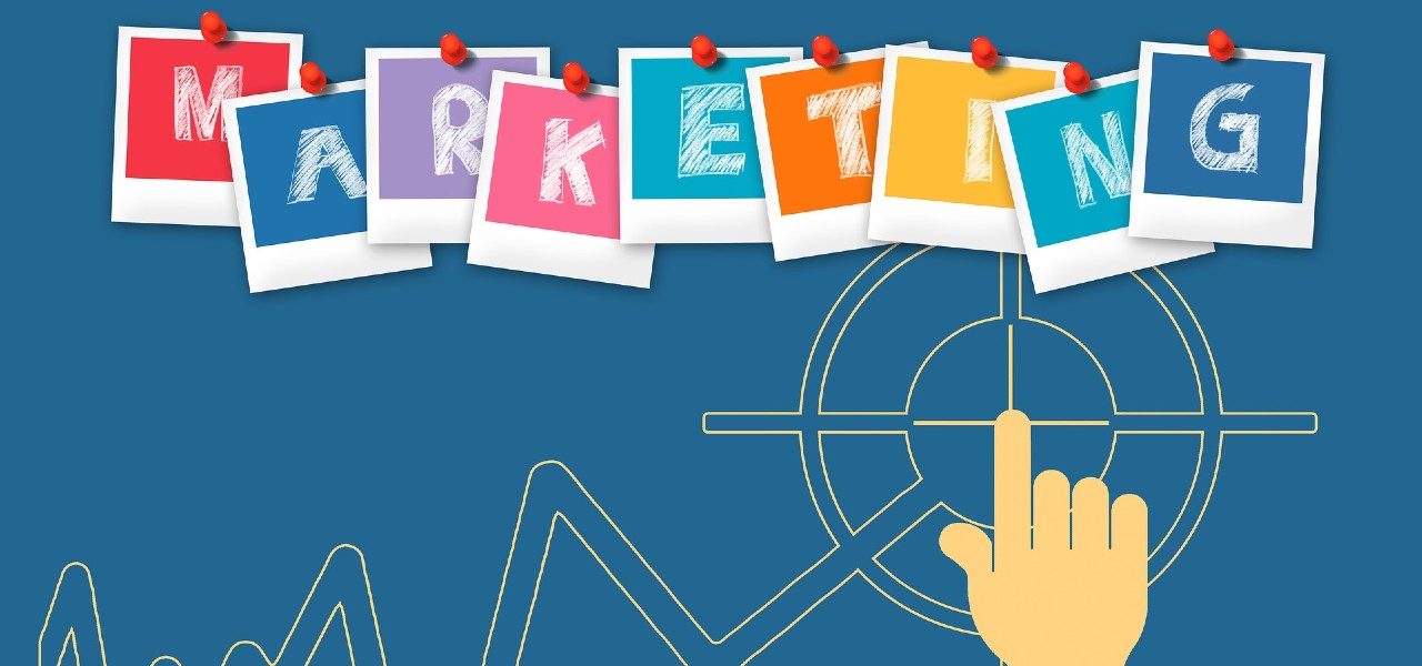 Illlustration of a hand pointing to Marketing written in capital letters